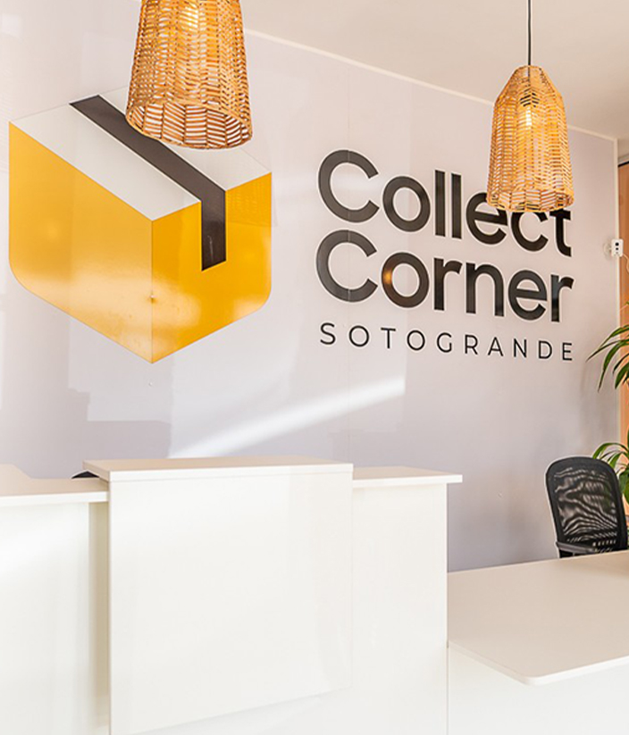 Interior of Collect Corner Sotogrande showing the reception desk, branded logo signage, and modern postal service workspace.